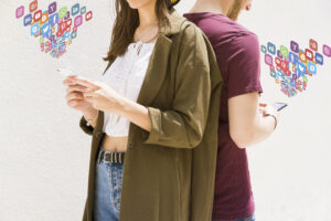couple with phones and apps flowing from them